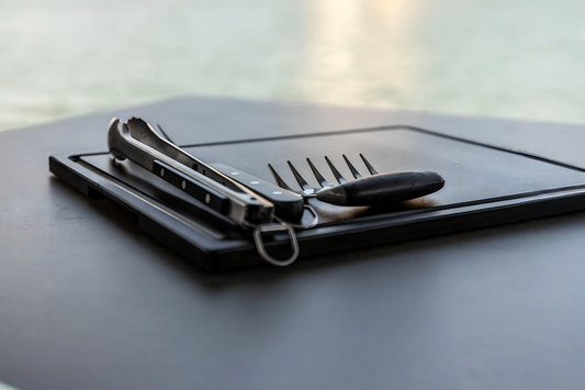 Side profile view of a 3/4-inch thick black PolySlice cutting board showing its thickness and juice groove.