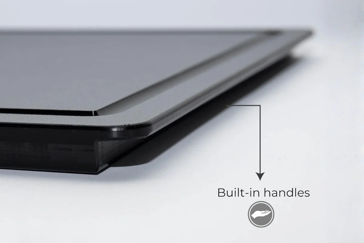 Black cutting board with built-in side handles for easy grip