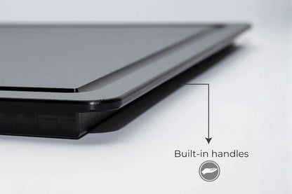 Black cutting board with built-in side handles for easy grip