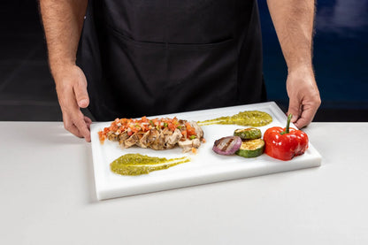 Chef holding a White PolySlice BBQ Serving Plate with grilled food