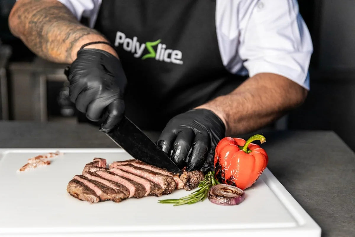 Chef slicing brisket on a White PolySlice professional prep station