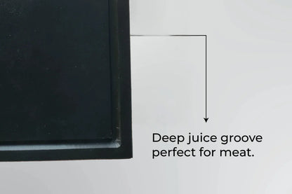 Close-up of the deep juice groove on a Black PolySlice BBQ HDPE Plate, perfect for resting meat and keeping surfaces clean.