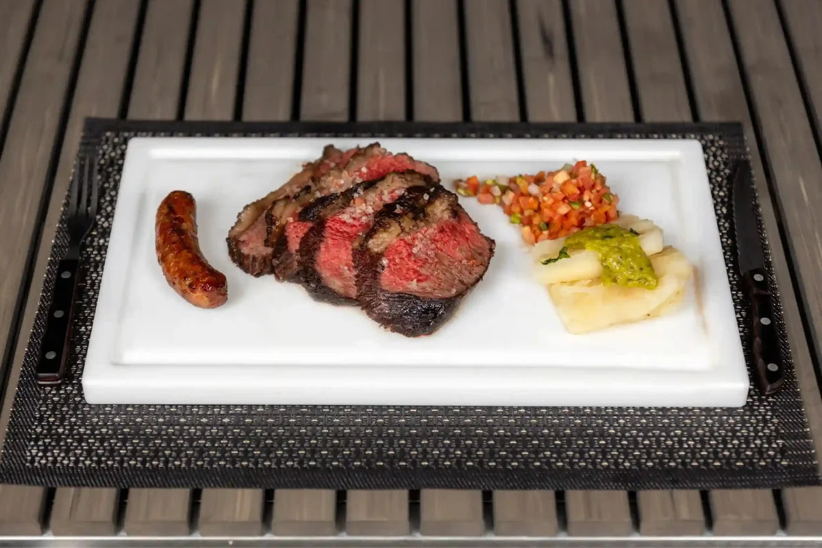 Grilled steak and sausage served on a White PolySlice BBQ Plate