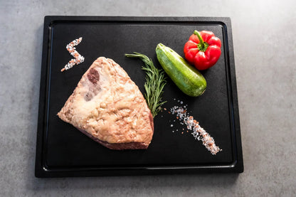 Preparing raw ingredients on a durable Black cutting board